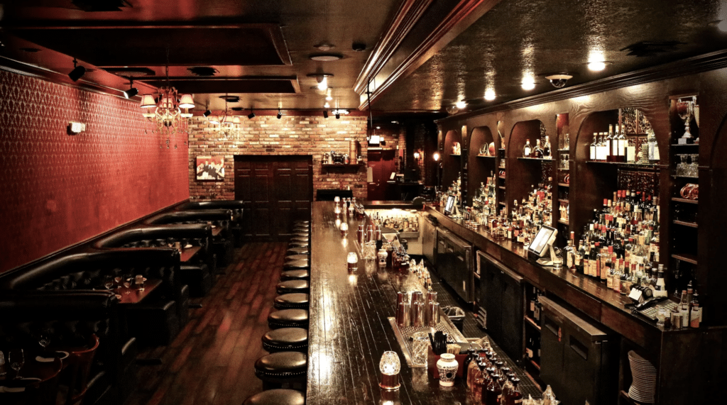 Speakeasy ambiance at Herbs & Rye, offering a unique and intimate setting for a romantic evening.